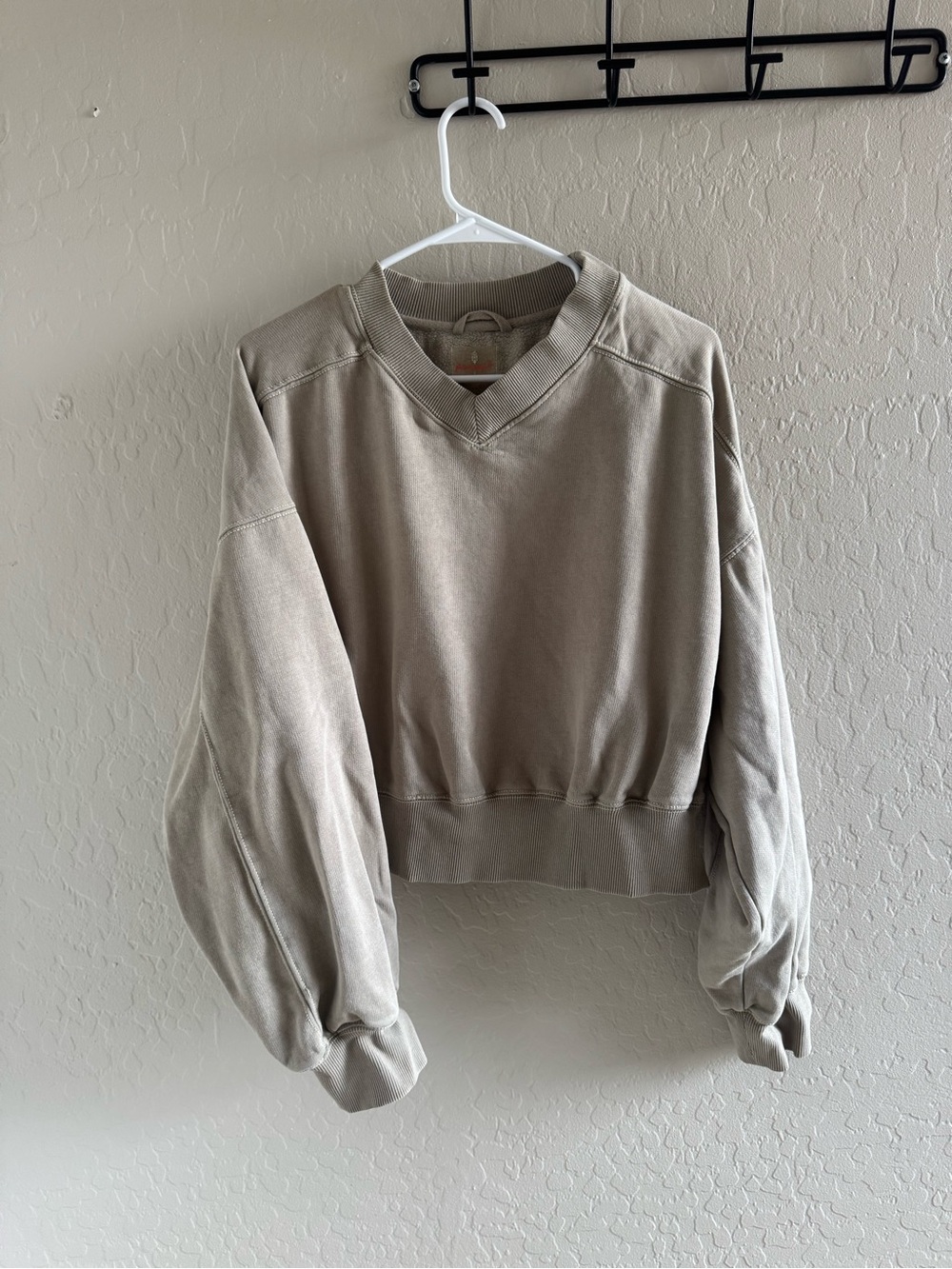 FP Movement by Free People Cropped V-Neck Pullover Sweatshirt in Taupe